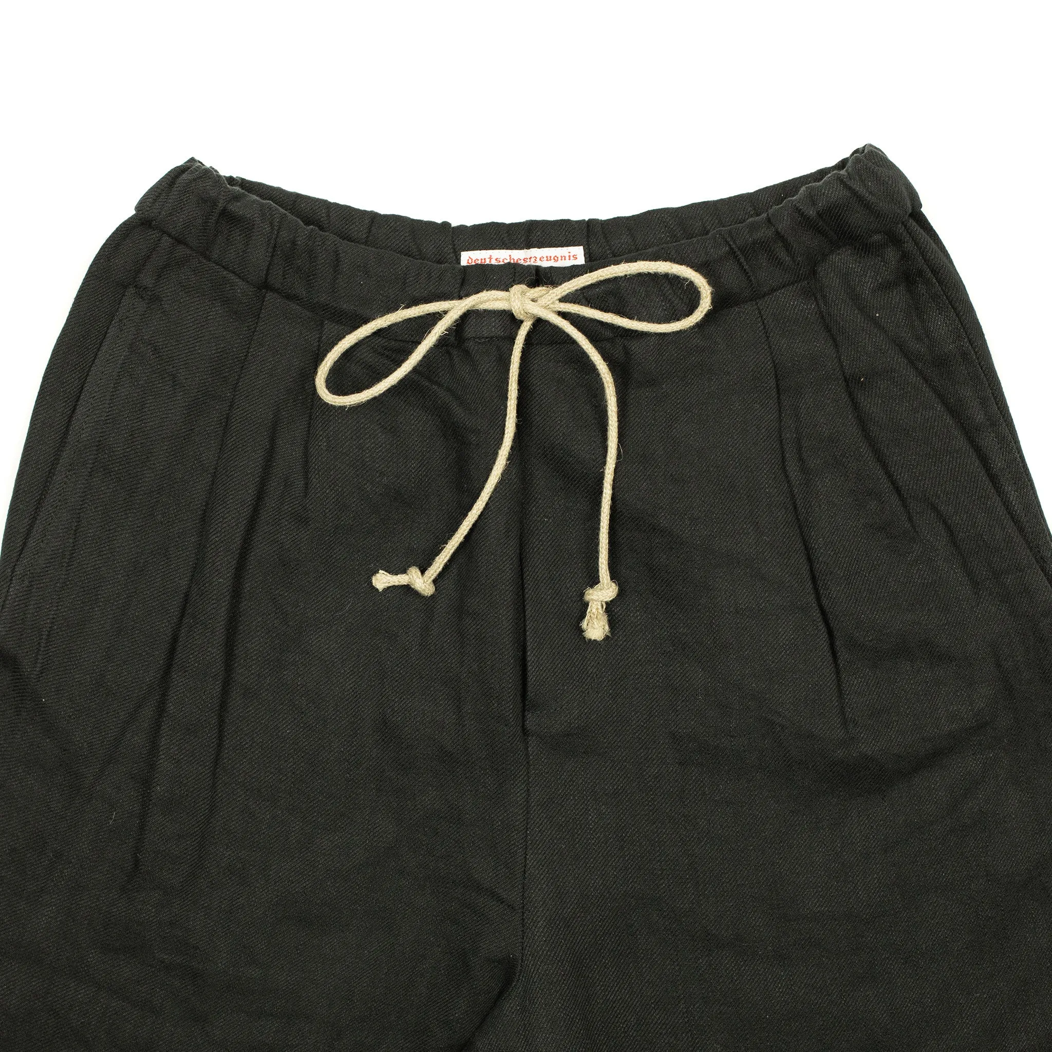 Pleated drawstring trousers in soft black washed linen twill