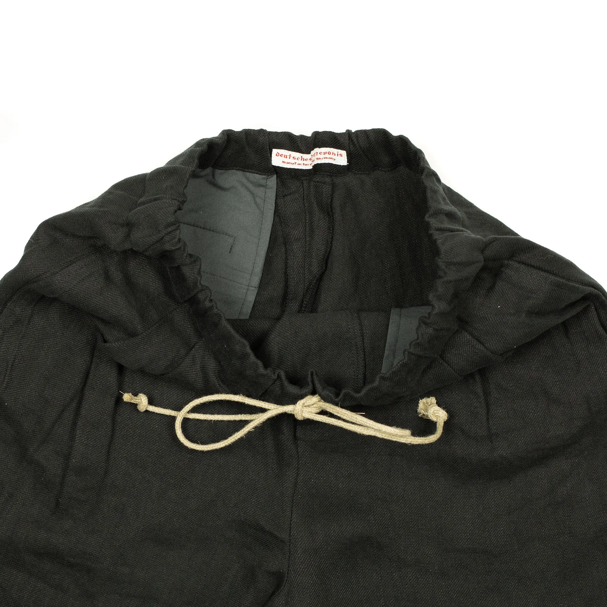 Pleated drawstring trousers in soft black washed linen twill